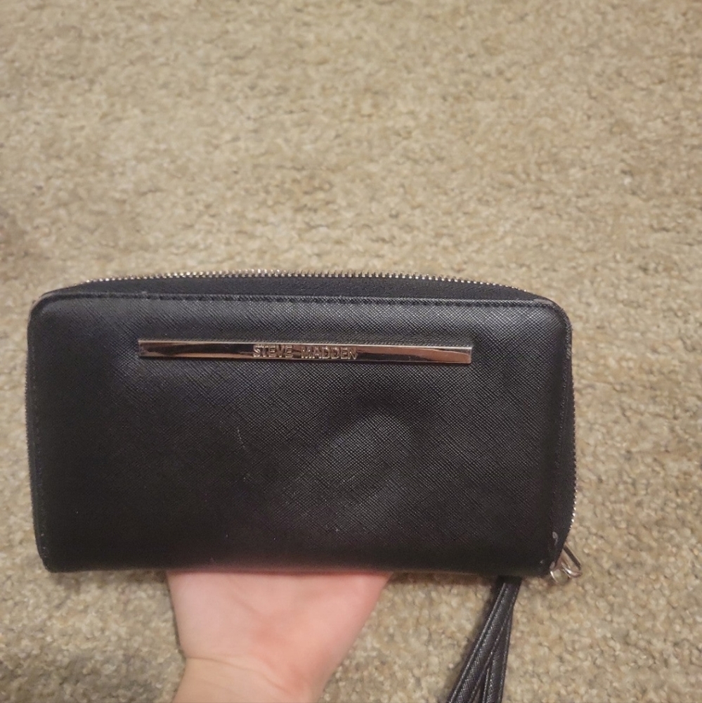 Steve Madden wallet does have a little dent
